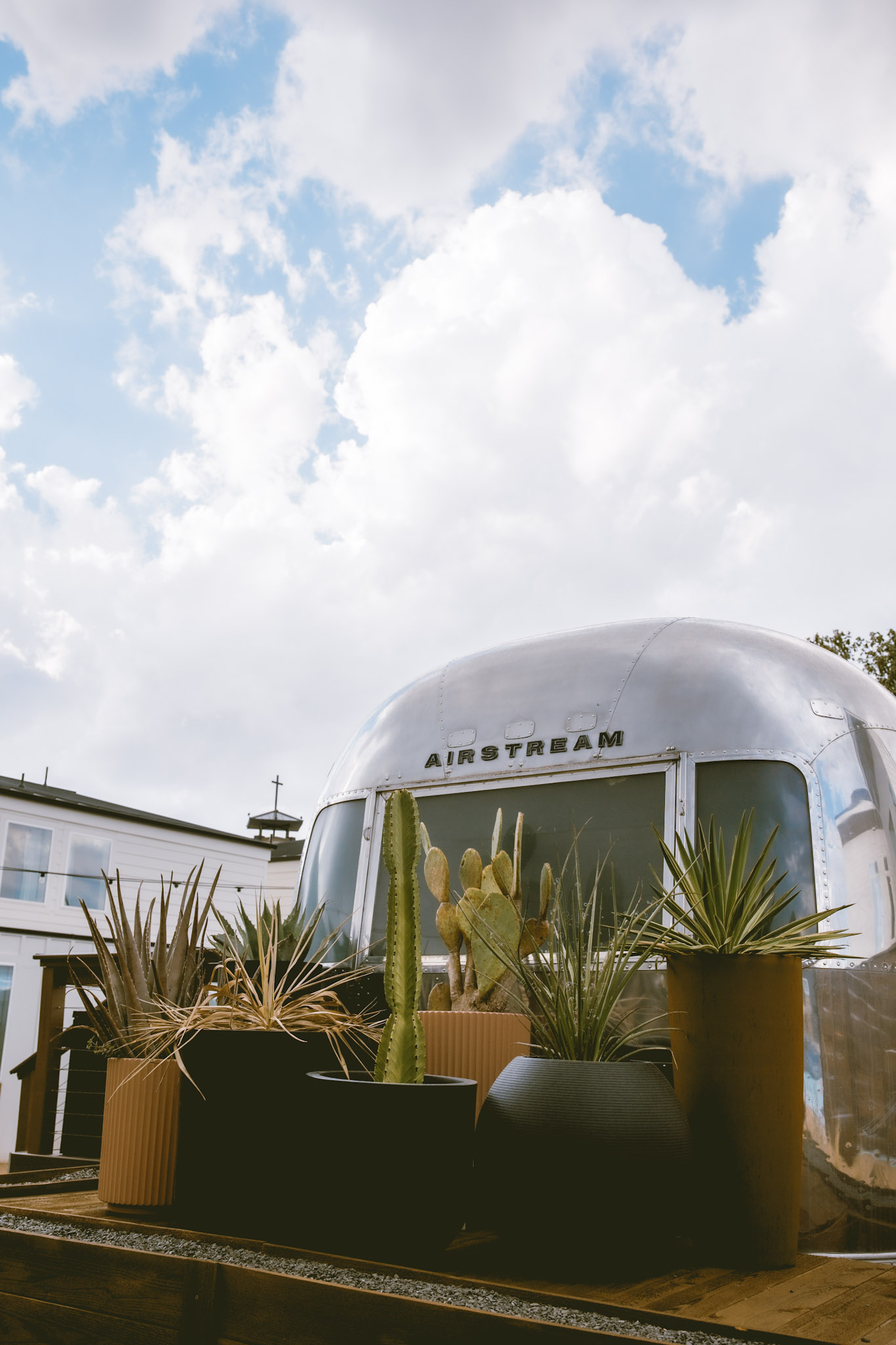 Polished vintage Airstream suite with cactus planters at Hotel SOMA in South Main Village, Fort Worth