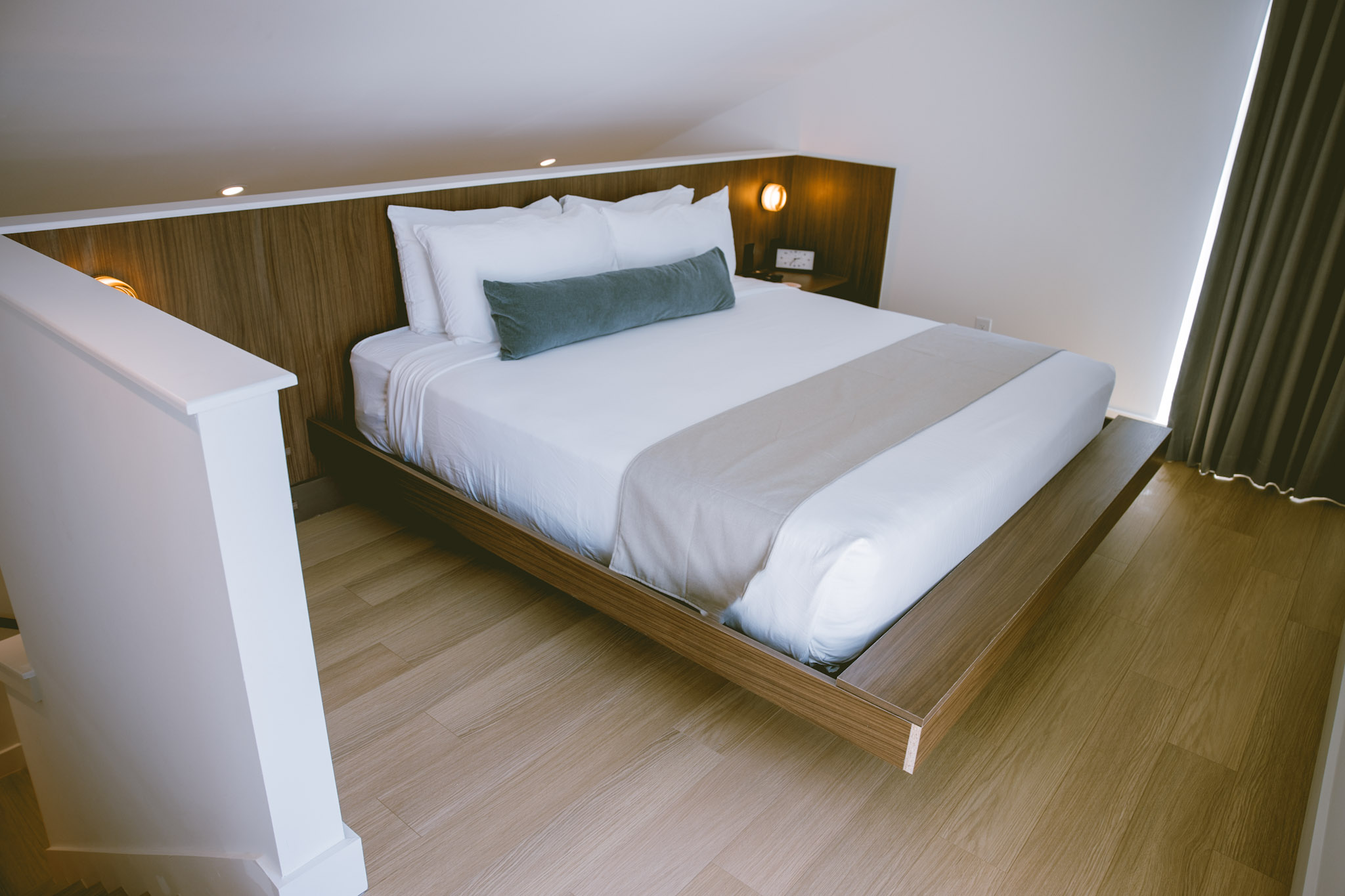 King bed with walnut headboard inside a Hotel SOMA private casita