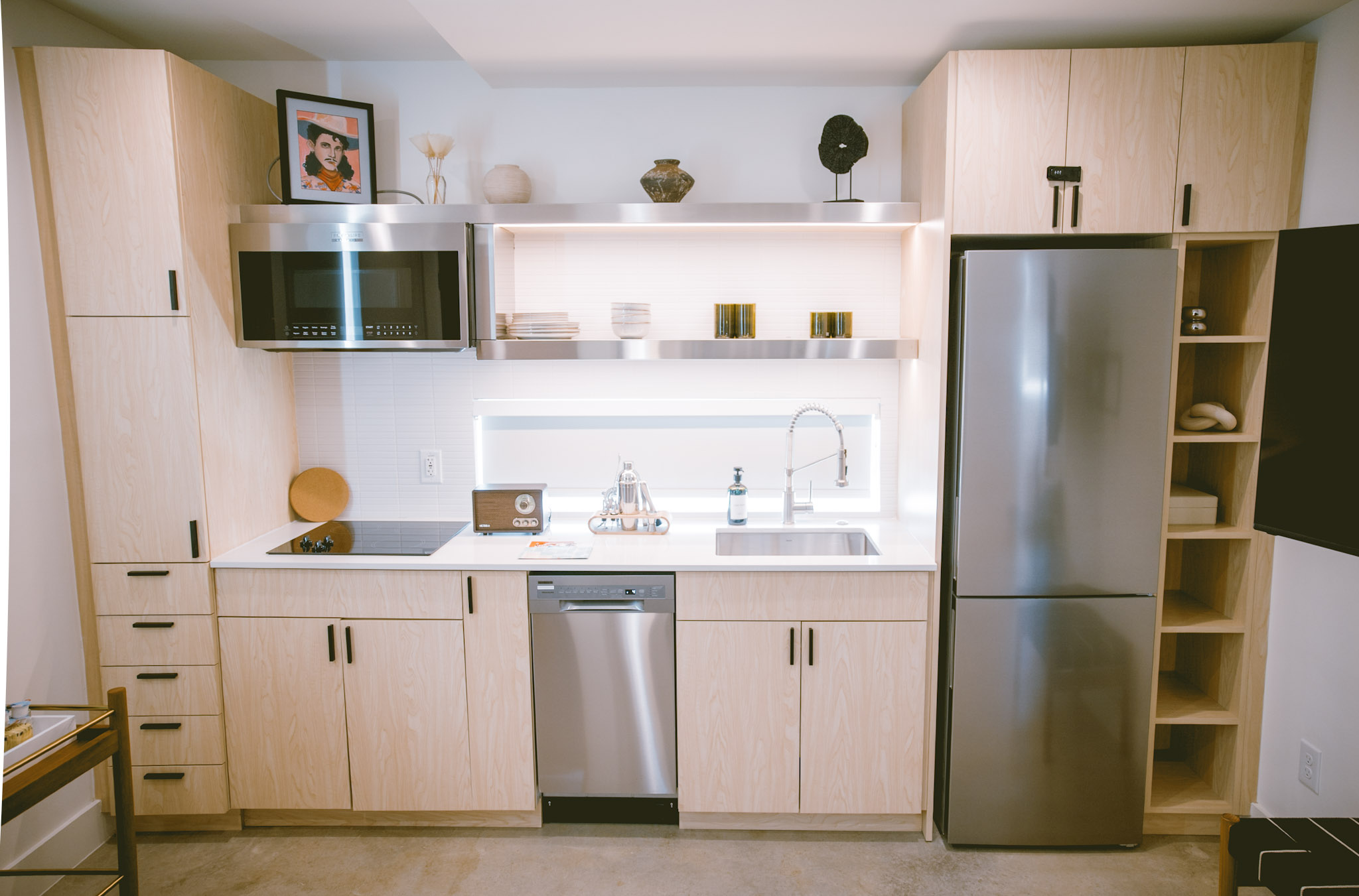 Full kitchen with stainless appliances inside a Hotel SOMA casita, Fort Worth
