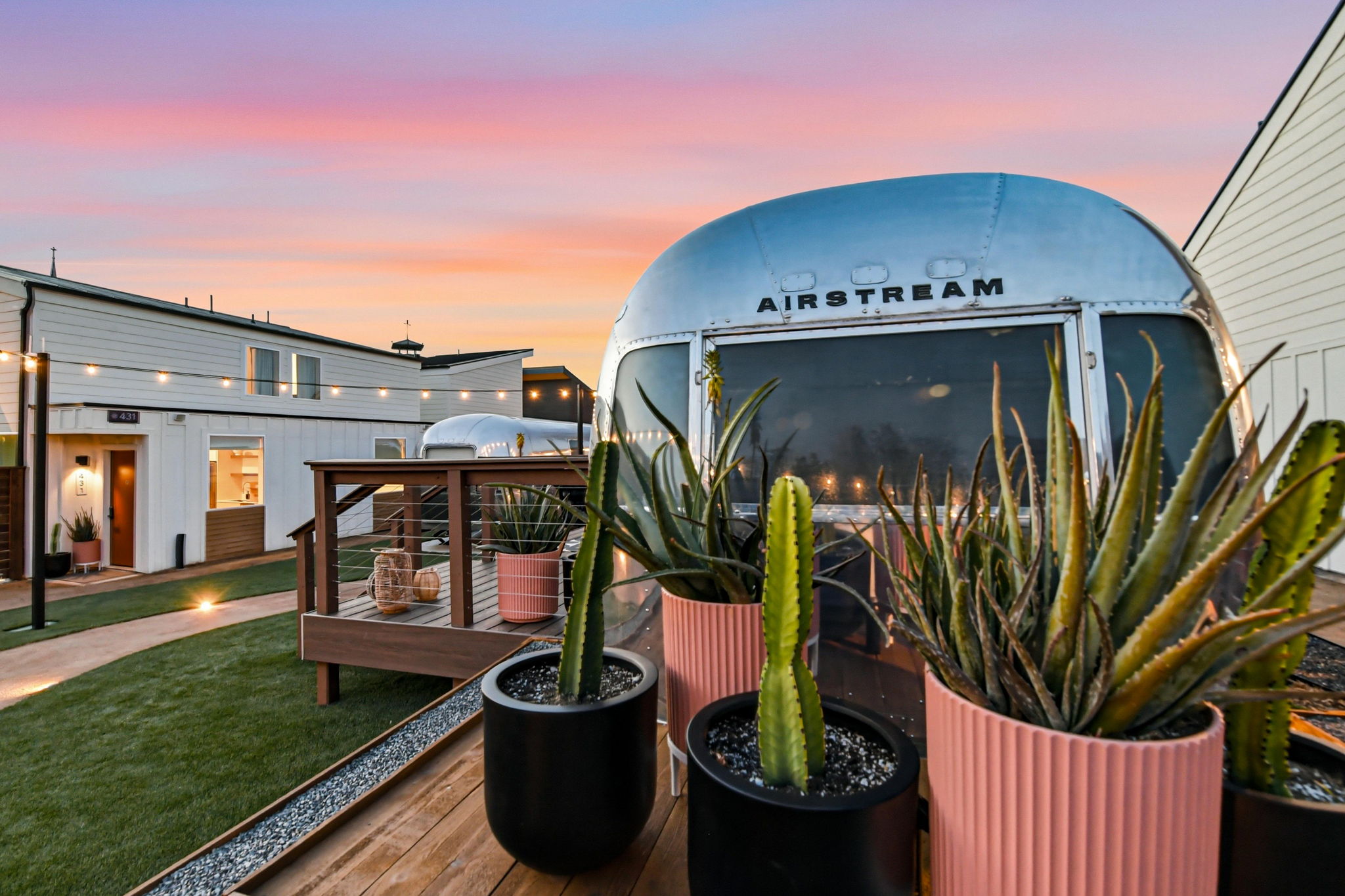 Polished Airstream suite at twilight in the SOMA courtyard